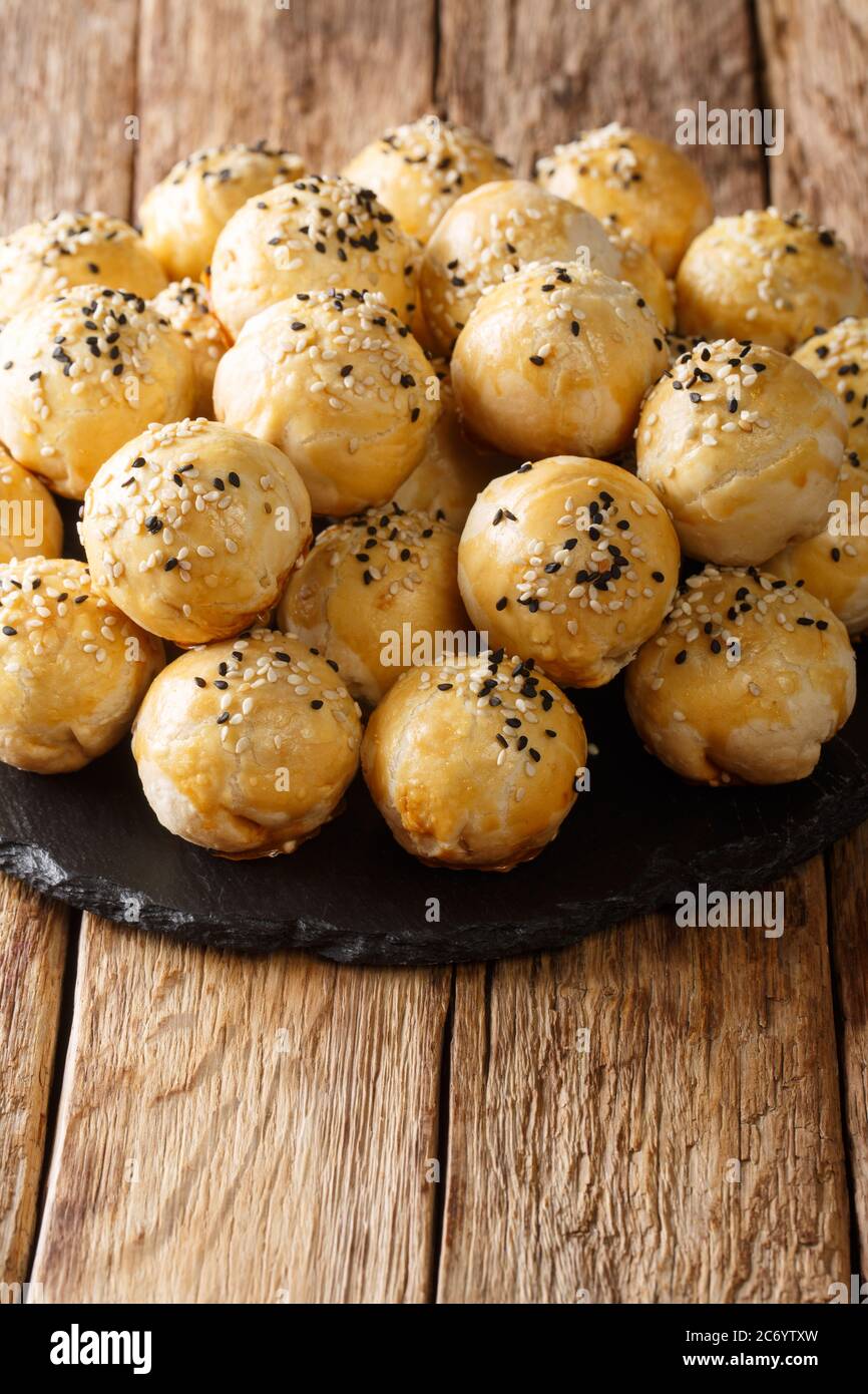 Traditional Malaysian Dessert Tambun Biscuit Stuffed With Mung Bean And   Traditional Malaysian Dessert Tambun Biscuit Stuffed With Mung Bean And Onion Close Up On The Table Vertical 2C6YTXW 