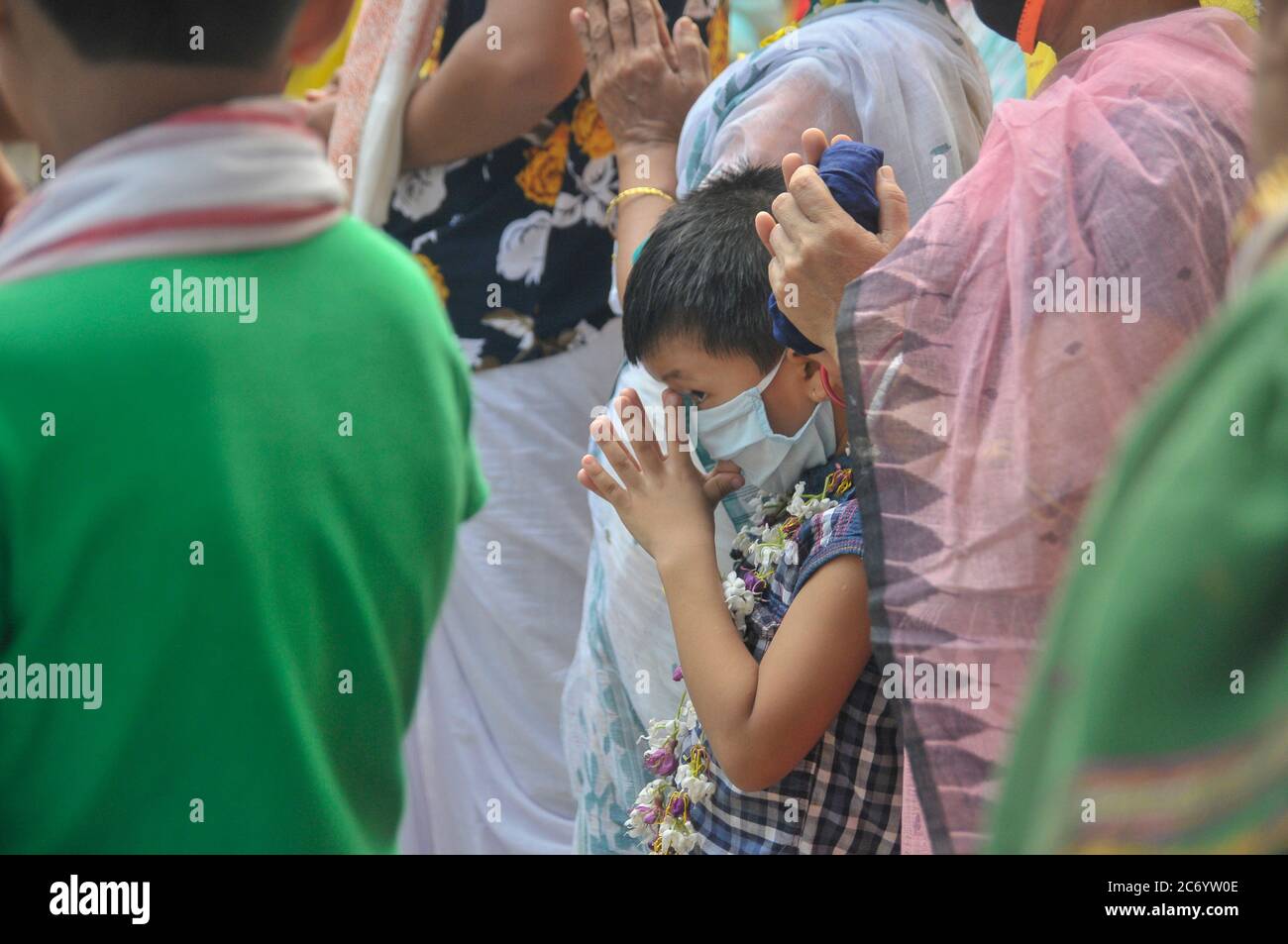 The annual Ratha Yatra is a ritual celebrated with much zeal and enthusiasm in the Temple precincts. The festival is a celebrated for almost a week, starting with the forward journey of the chariot and ending up wuth tge reverse homeward journey. This year, the journey of the deity is only bound within the yards of the Sri Sri Mohaprobhu Mondir, Sagordighir par, due to covid19 pandemic. Sylhet, Bangladesh. Stock Photo