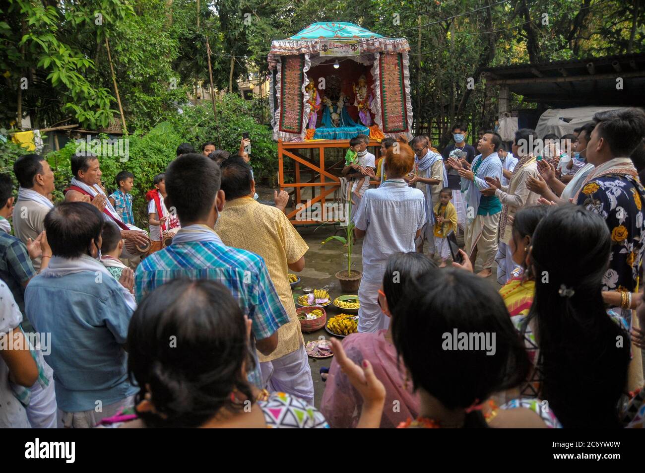 The annual Ratha Yatra is a ritual celebrated with much zeal and enthusiasm in the Temple precincts. The festival is a celebrated for almost a week, starting with the forward journey of the chariot and ending up wuth tge reverse homeward journey. This year, the journey of the deity is only bound within the yards of the Sri Sri Mohaprobhu Mondir, Sagordighir par, due to covid19 pandemic. Sylhet, Bangladesh. Stock Photo