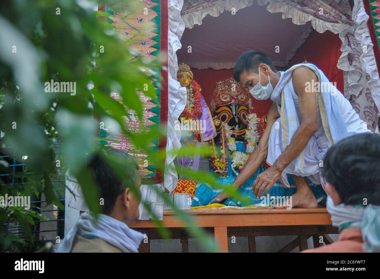 The annual Ratha Yatra is a ritual celebrated with much zeal and enthusiasm in the Temple precincts. The festival is a celebrated for almost a week, starting with the forward journey of the chariot and ending up wuth tge reverse homeward journey. This year, the journey of the deity is only bound within the yards of the Sri Sri Mohaprobhu Mondir, Sagordighir par, due to covid19 pandemic. Sylhet, Bangladesh. Stock Photo