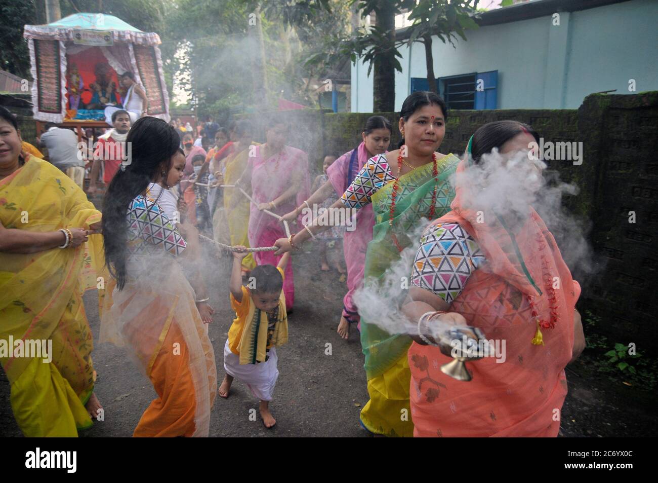 The annual Ratha Yatra is a ritual celebrated with much zeal and enthusiasm in the Temple precincts. The festival is a celebrated for almost a week, starting with the forward journey of the chariot and ending up wuth tge reverse homeward journey. This year, the journey of the deity is only bound within the yards of the Sri Sri Mohaprobhu Mondir, Sagordighir par, due to covid19 pandemic. Sylhet, Bangladesh. Stock Photo