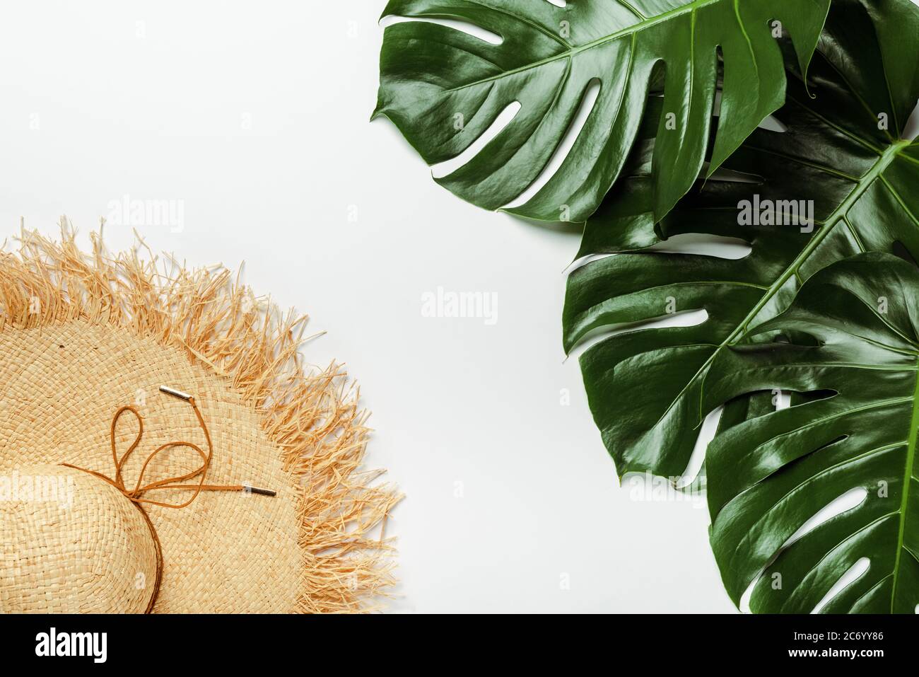 top view of green palm leaves, straw hat on white background Stock ...