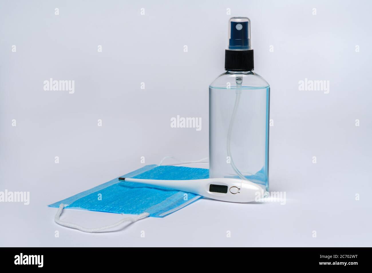 bottle of lotion, sanitizer or liquid soap, electronic thermometer and