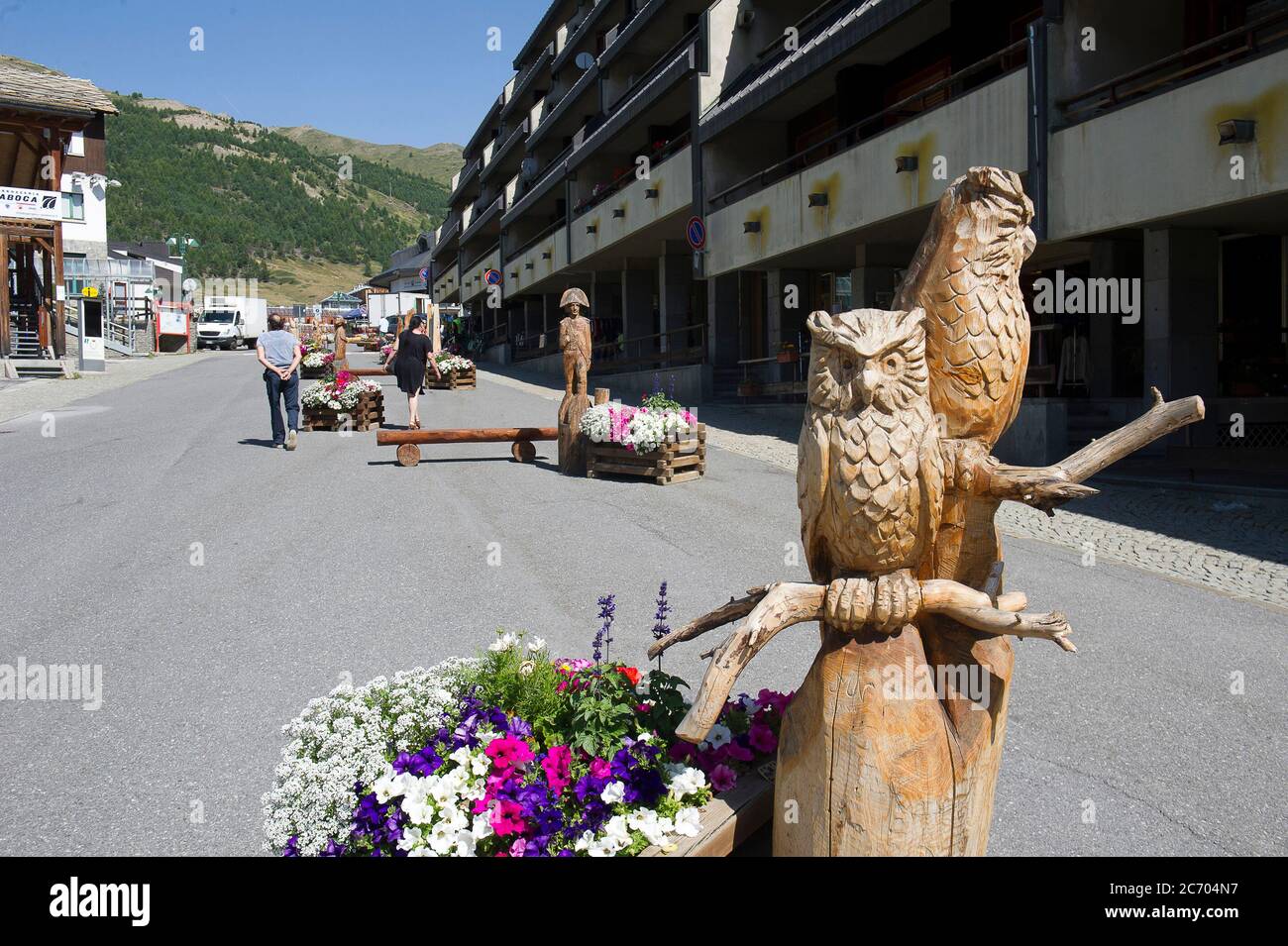 Europe, Italy, Piedmont, Sestriere wood carvings in the square. Upper Susa Valley, Val Chisone Stock Photo