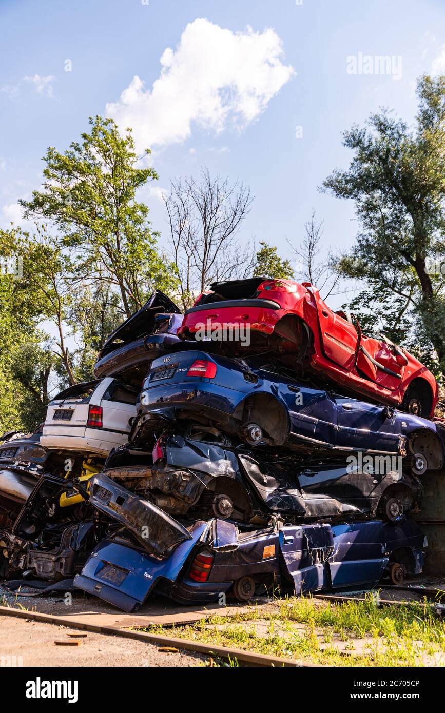 Cars piled on top of each other in junkyard Stock Photo Alamy