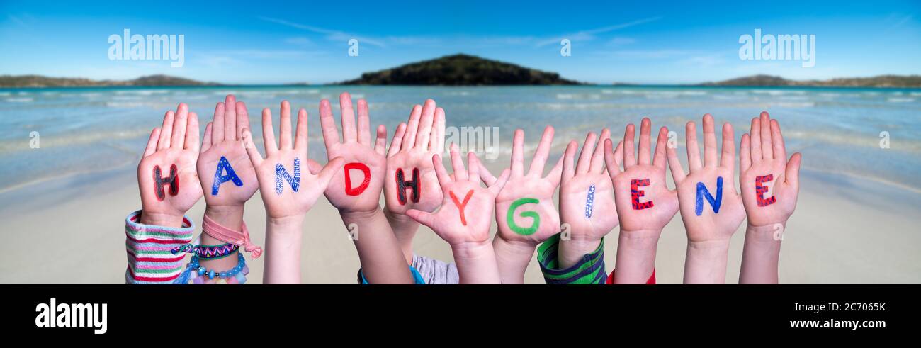 Kids Hands Holding Word Handhygiene Means Hand Hygiene, Ocean Background Stock Photo