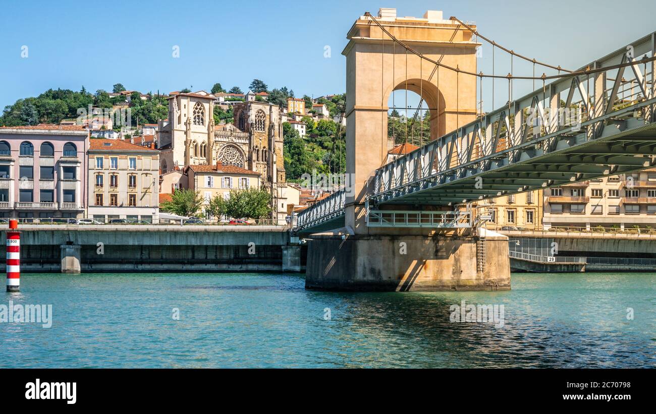 Scenic panorama of Vienne city with the footbridge over Rhone River and Saint Maurice Cathedral of Vienne Isere France Stock Photo