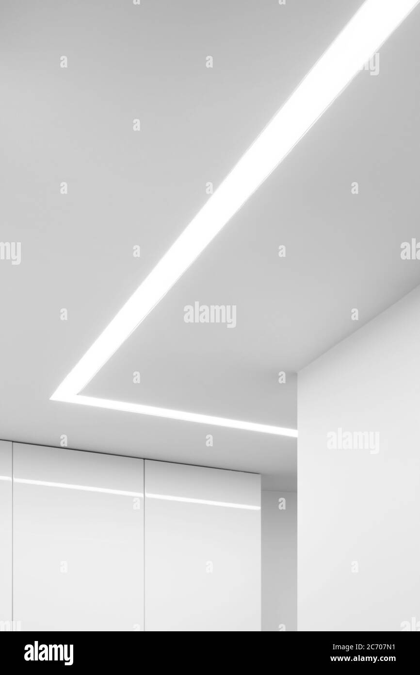 Modern interior in white with decorative led ceiling light Stock Photo