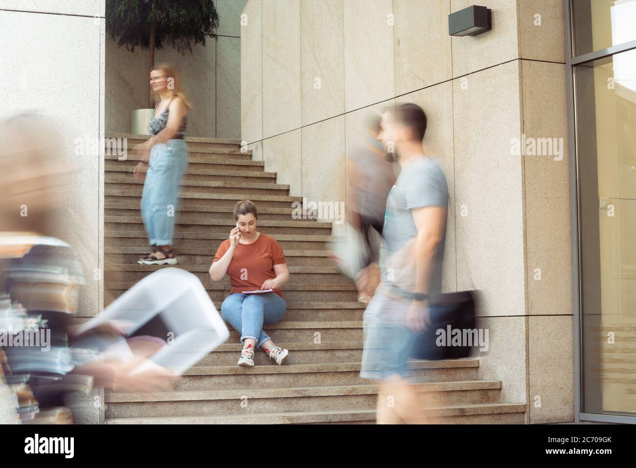 Manager, paperwork. Caucasian inclusive plus-size model in daily routine. Realness, tolerance. Her lifestyle is the same like of other people. Concept of wellness, inclusion, diversity, human rights. Stock Photo