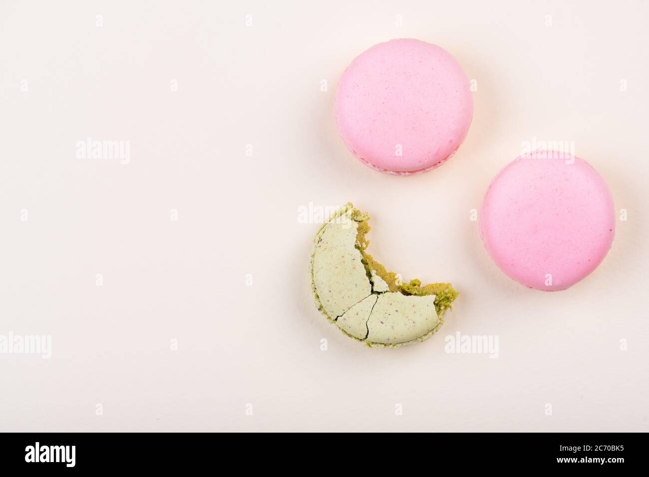 Macaroons on yellow background. Top view. Stock Photo