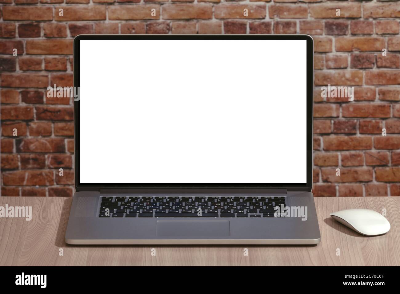 Laptop with white blank screen on the office desk Stock Photo - Alamy