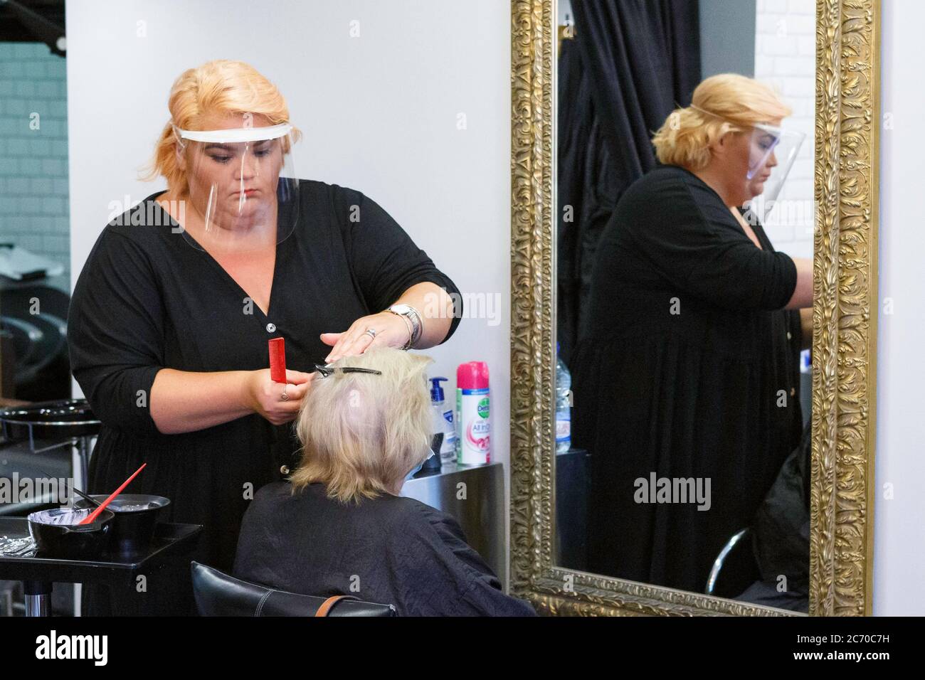 Carmarthen, Carmarthenshire, Wales, UK. 13 July, 2020. A lady has a haircut in Cloud 9 Salon as barbers and hairdressers re-open in Wales with the easing of Coronavirus / Covid-19 lockdown restrictions.. Credit: Gruffydd Ll. Thomas/Alamy Live News Stock Photo