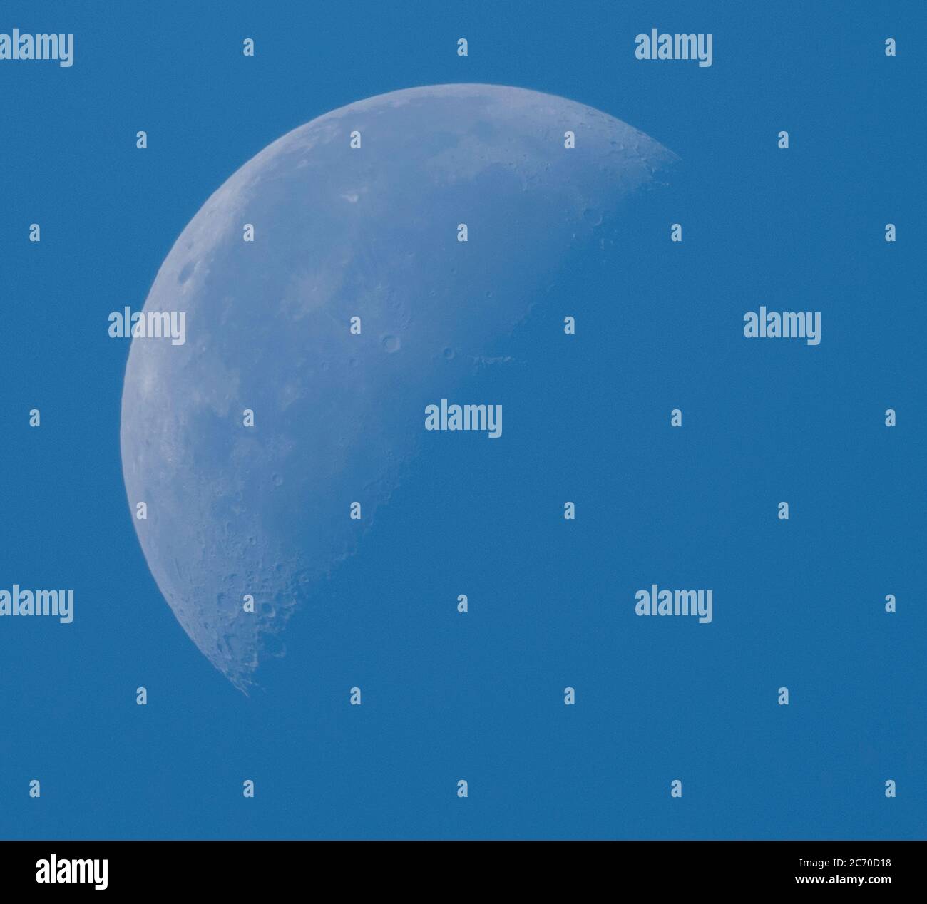 13th July 2020. Waning crescent daytime moon, 45% illuminated, photographed above London, UK Stock Photo