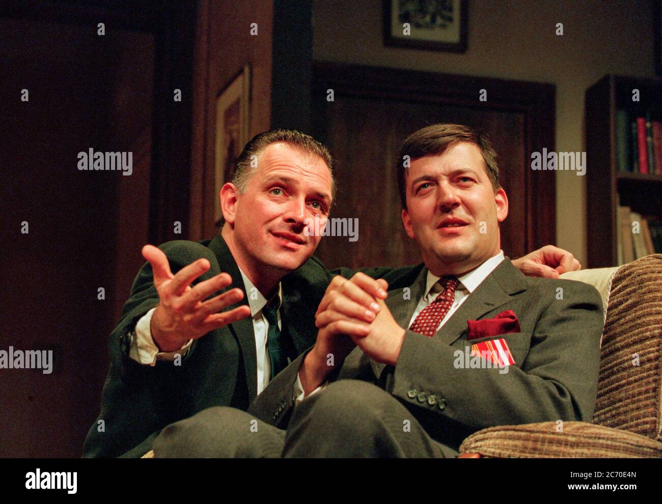 l-r: Rik Mayall (Sean Bourke), Stephen Fry (George Blake) in CELL MATES by Simon Gray at the Albery Theatre, London WC2  16/02/1995  set design: Eileen Diss  costumes: Dany Everett  lighting: Mick Hughes  director: Simon Gray Stock Photo