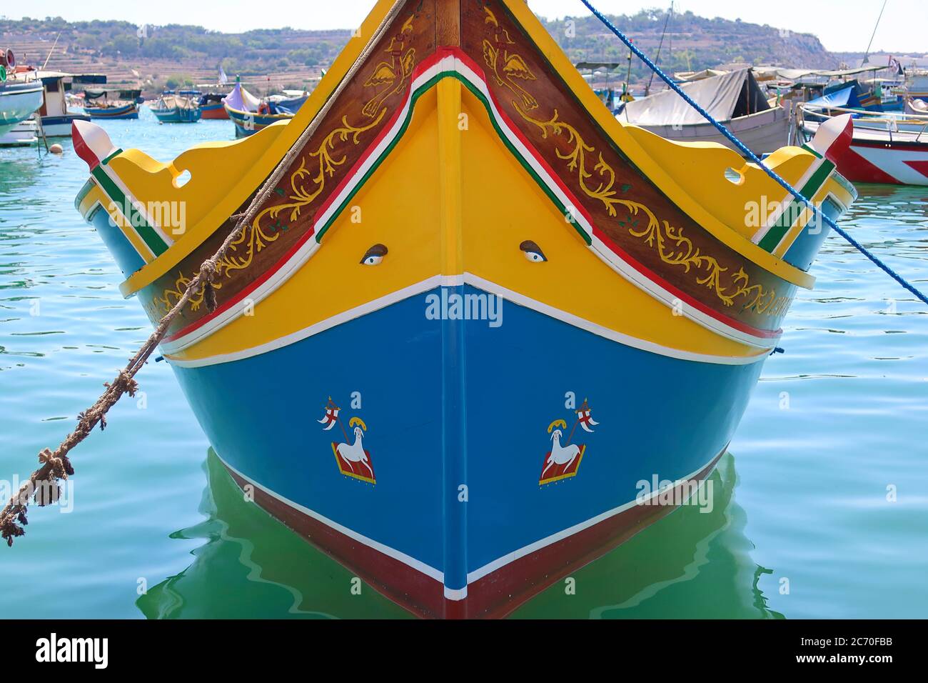 Typical maltese fishing boat, called luzzu with the eye of Osiris, in Marsaxlokk, Malta Stock Photo