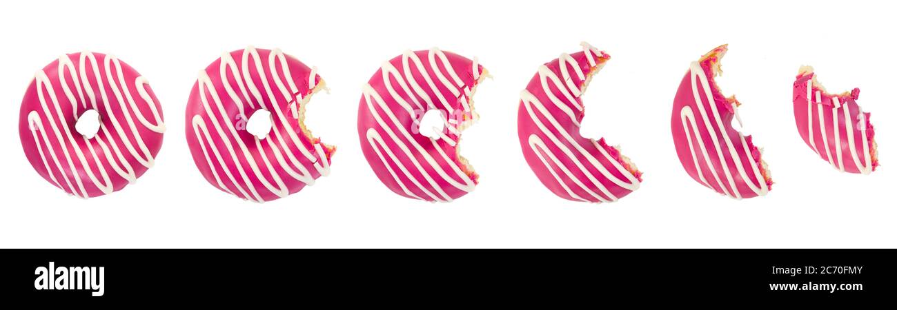 Eaten donut with pink icing and white stripes isolated on white background. Top view. Stock Photo