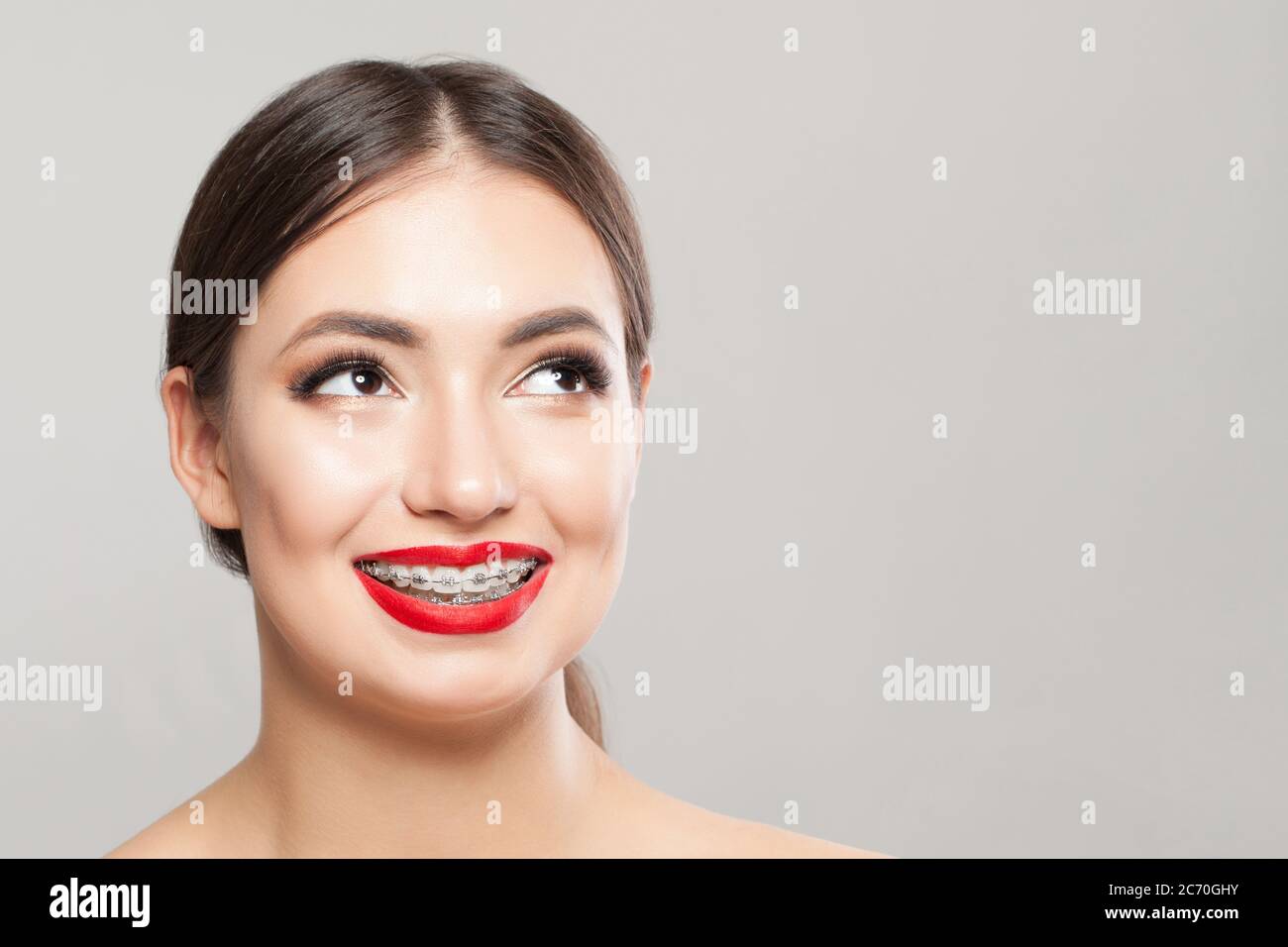Happy smiling woman with braces on teeth, face close up Stock Photo - Alamy