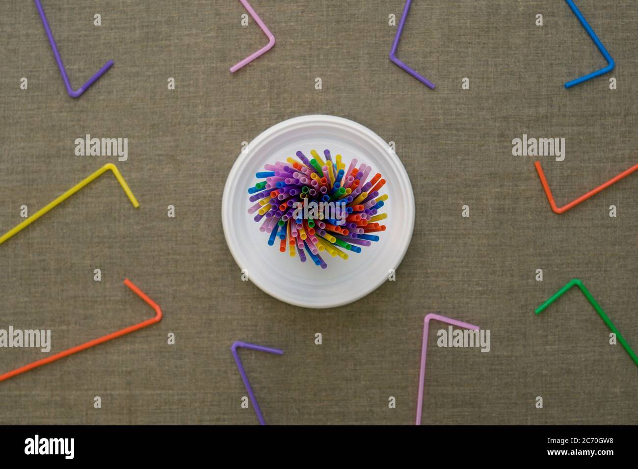 Top view on multi-colored disposable tubes. Environmental concept. Flat lay. Stock Photo