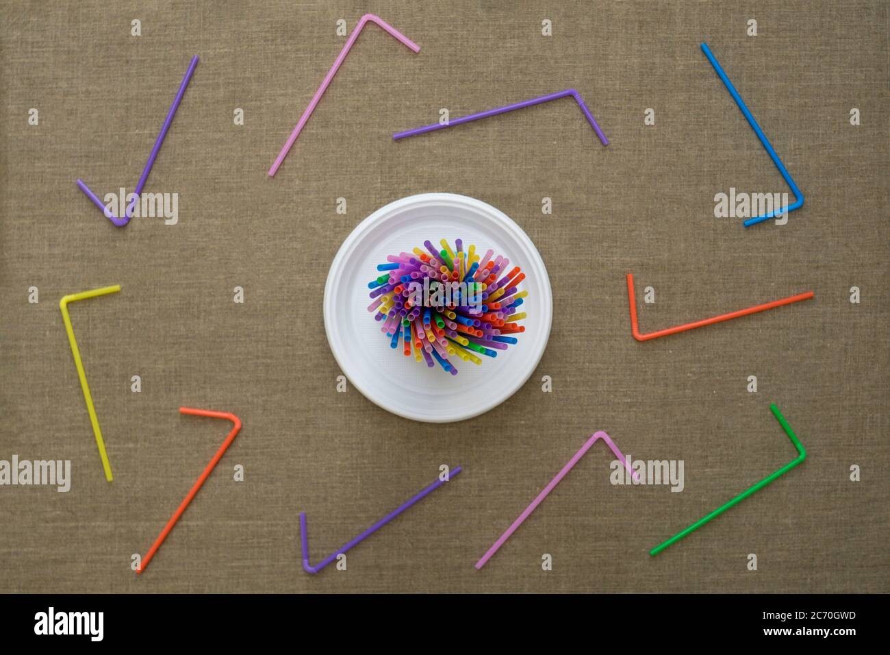 Top view on multi-colored disposable tubes. Environmental concept. Flat lay. Stock Photo