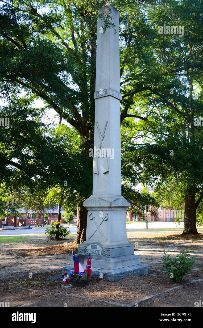 A Confederate monument under the shade of the trees in a park Stock Photo