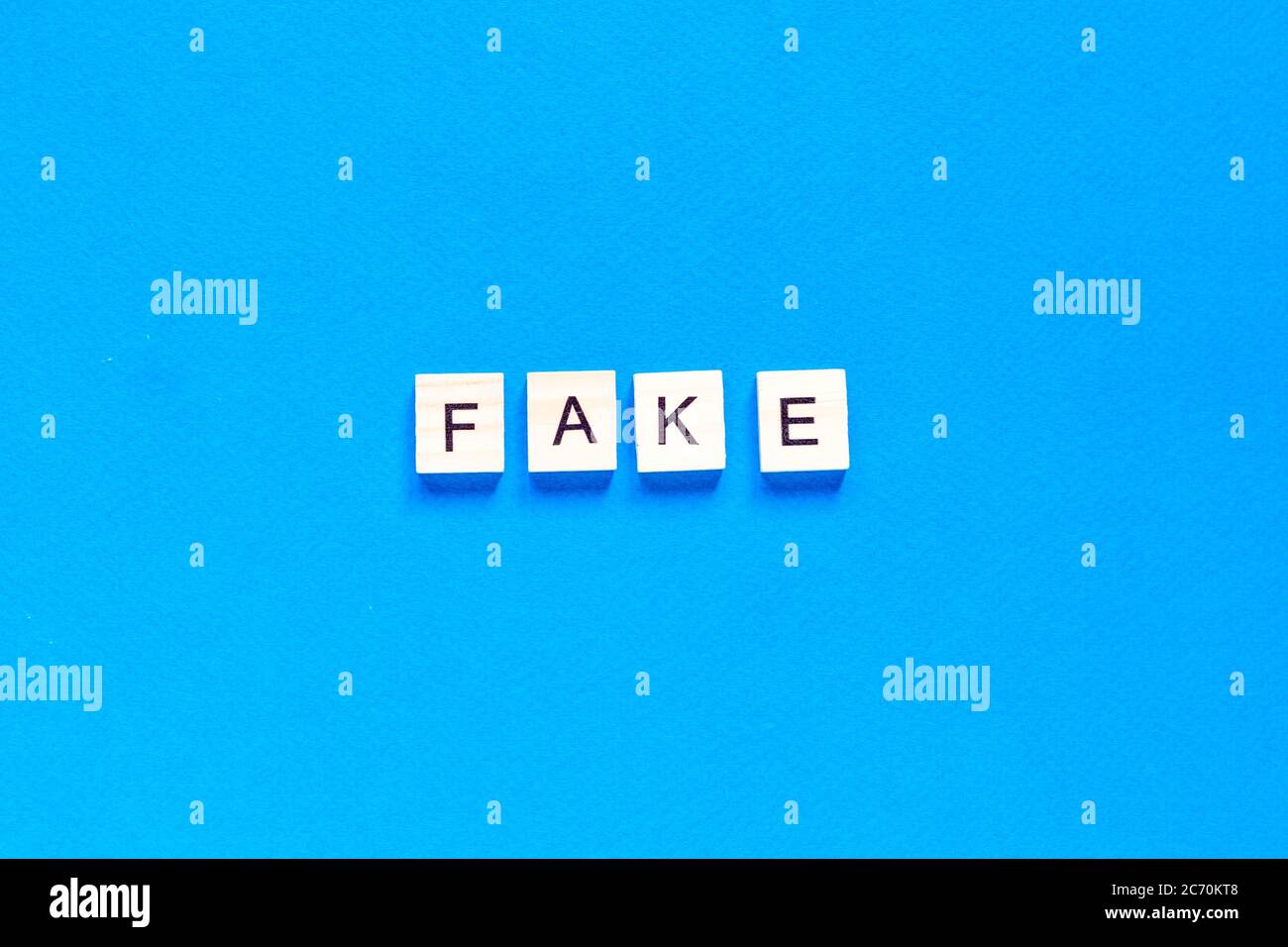 Fake word alphabet letters on blue background. flat layout. top view. Stock Photo