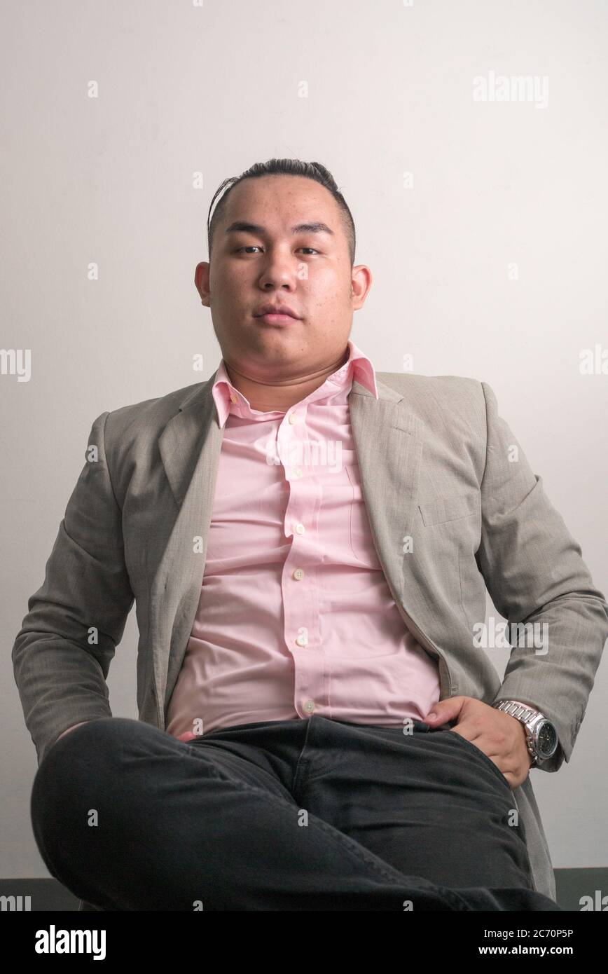 Fat guy sitting in chair hires stock photography and images Alamy