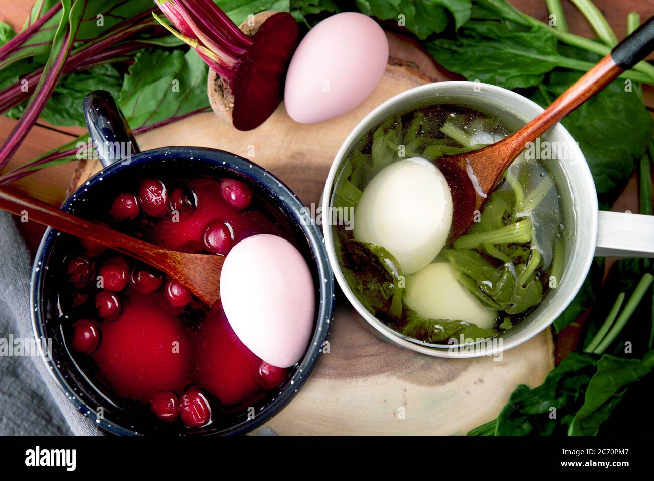 Homemade painting Easter eggs with spinach and beet dyes. Non-toxic coloring Stock Photo