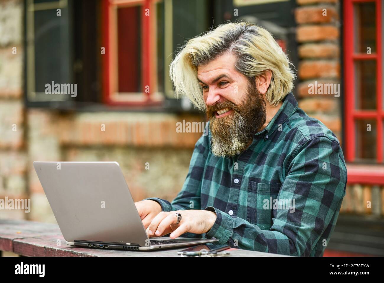 Online business. Online entrepreneur working outdoors. Man busy work with laptop. Businessman laptop terrace. Online education. Surfing internet. Modern communication. Risky shopping. Stock trader. Stock Photo