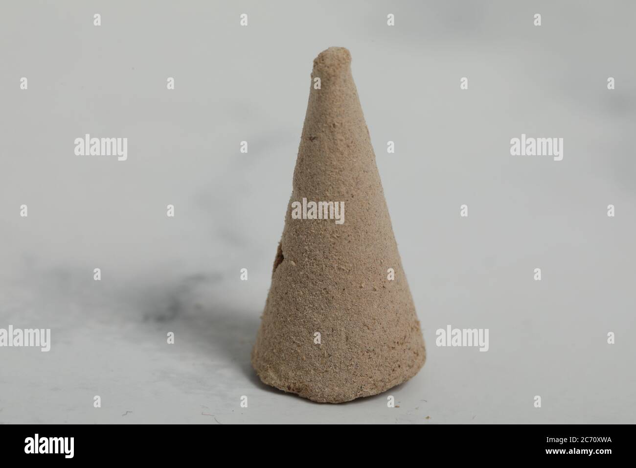 relaxation incense cone on white marble background. Good smell stick