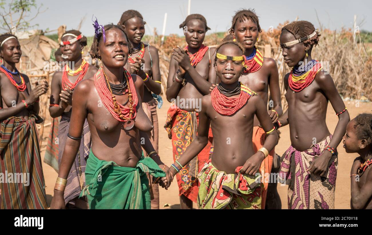 Omorate, Ethiopia - September 2017: Unidentified women from Dassanech tribe singing and dancing in their village near the Omorate river, Ethiopia Stock Photo