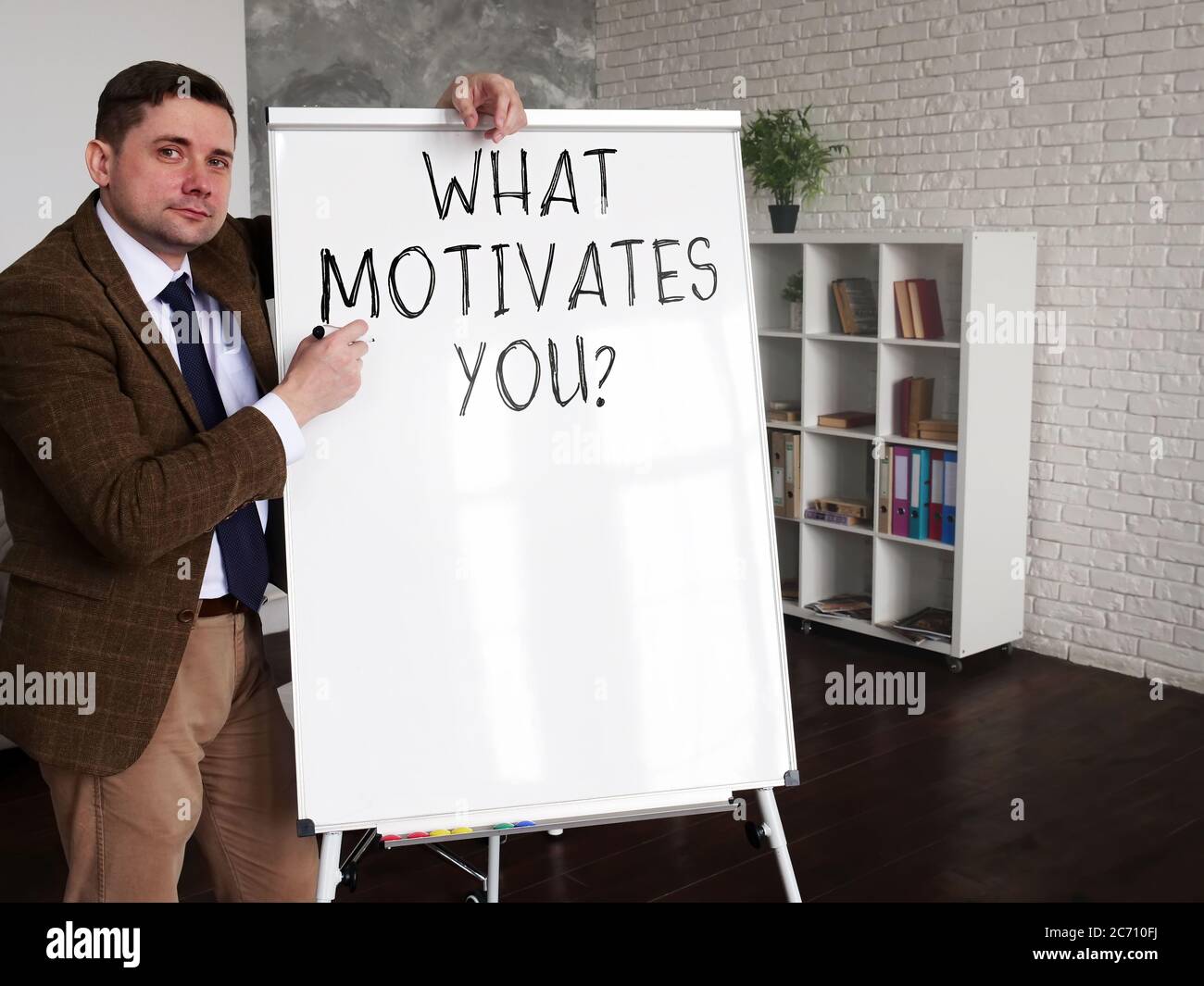 Mentor asks What motivates you. Career development concept. Stock Photo