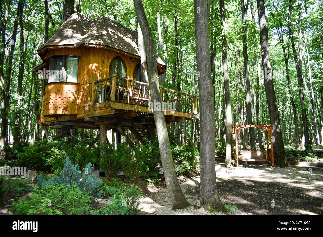 wooden-house-in-the-tree-edenland-park-in-bucharest-romania-stock