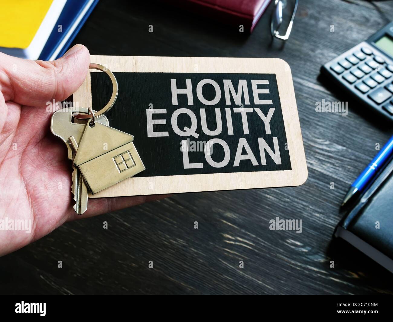 Home Equity Loan sign and key for house. Stock Photo