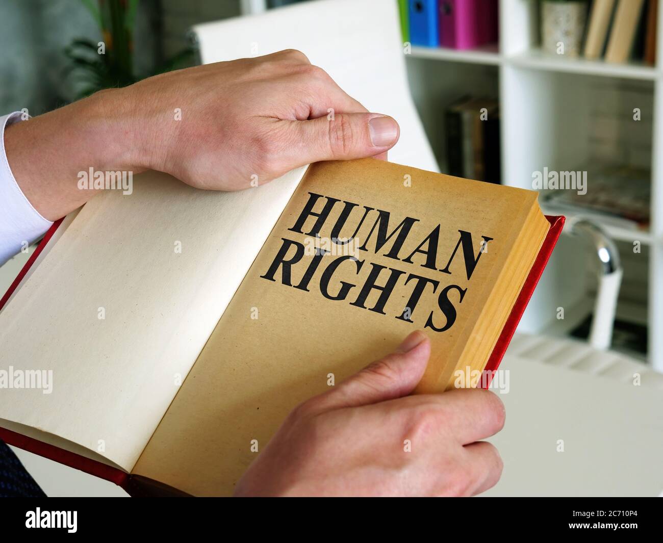 Lawyer opened a book with human rights law Stock Photo Alamy