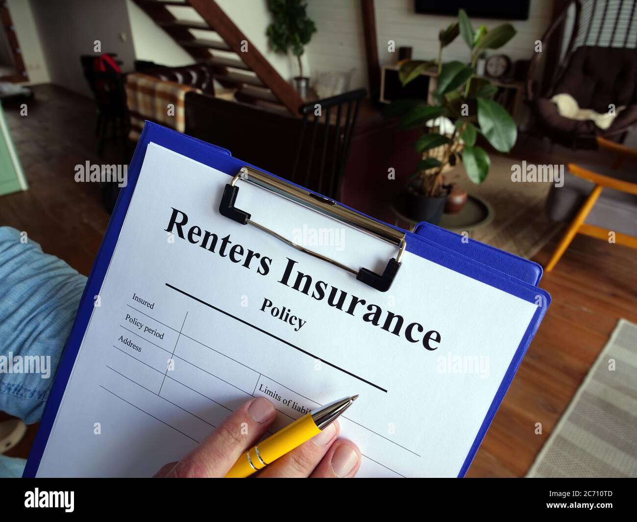 The agent fills out the renters insurance policy. Stock Photo