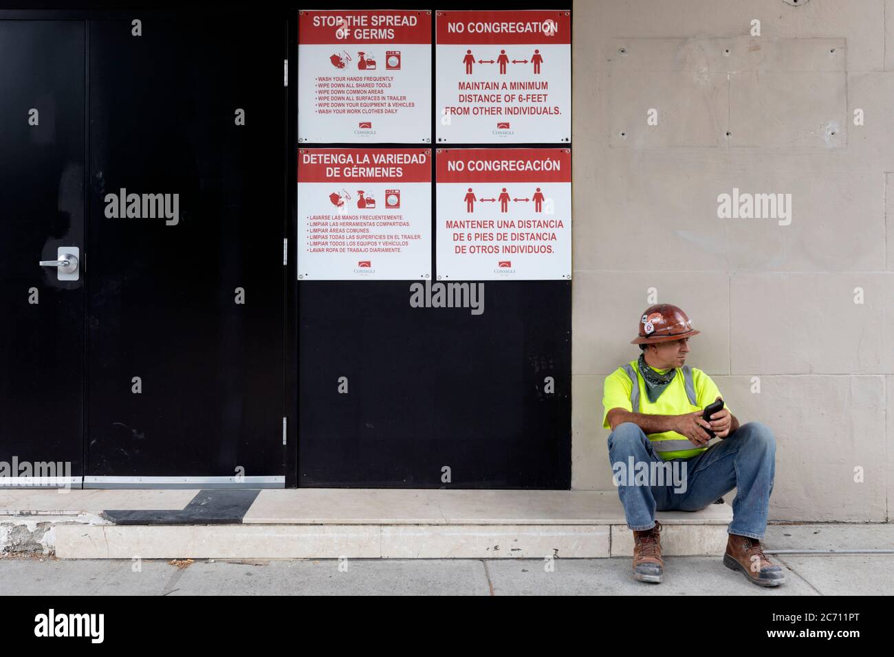 Construction worker on job site with COVID-19 restrictions, Boston Massachusetts USA Stock Photo
