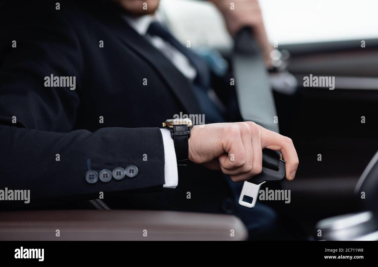 Business Man Putting On Seat Belt Sitting In His Car Stock Photo Alamy