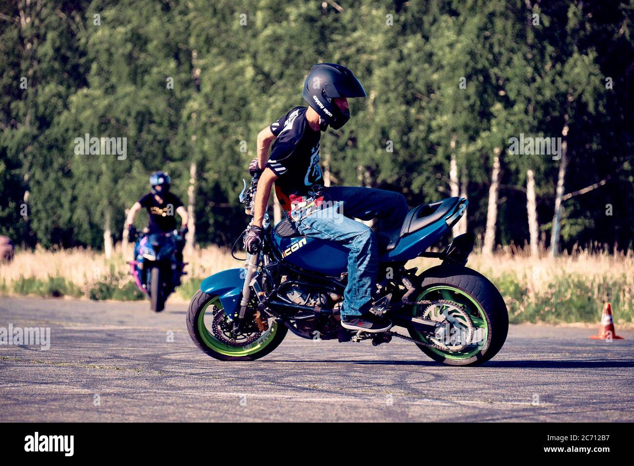 Moscow, Russia - 12 Jul 2020: Moto rider making a stunt on his motorbike.  Stunt motorcycle rider performing motorcycle show. Motorcyclist making doin  Stock Photo - Alamy