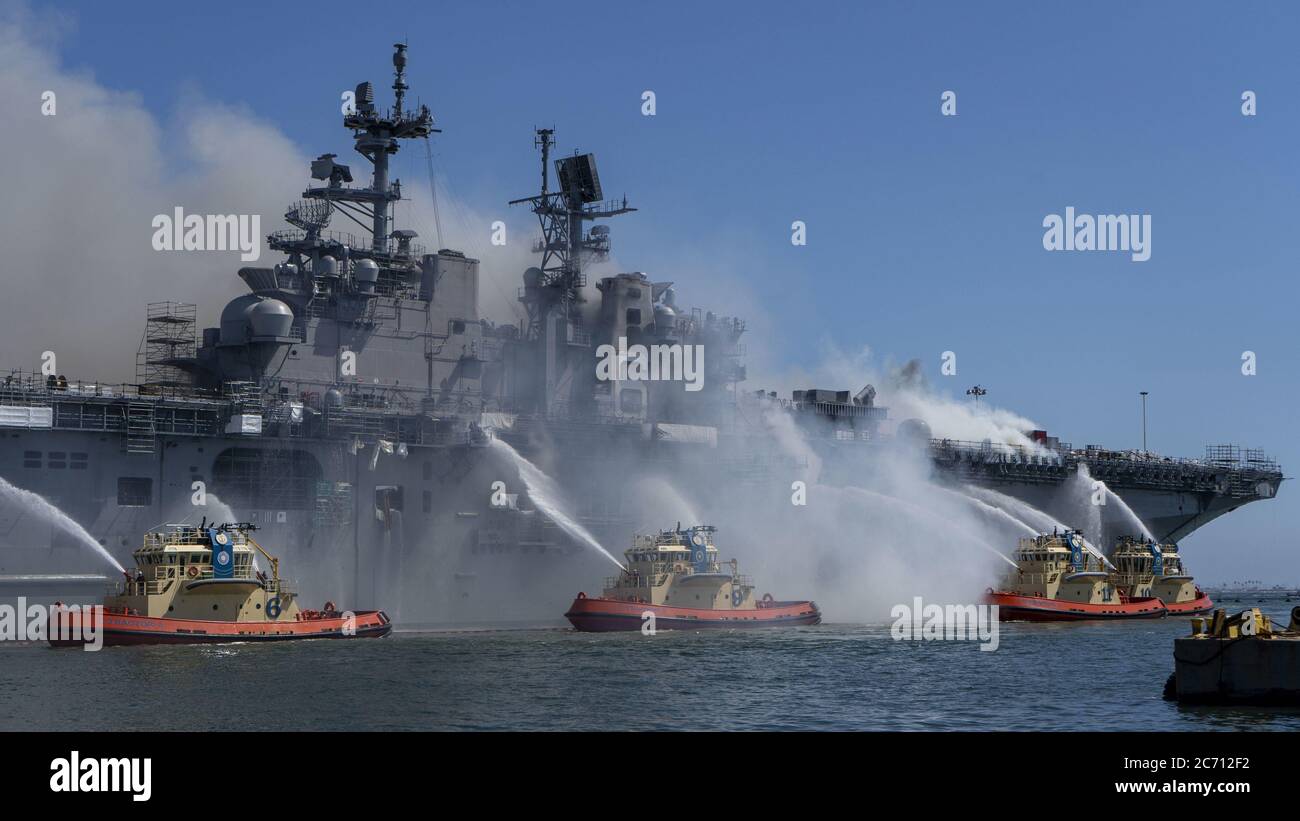 San Diego, United States. 13th July, 2020. Sailors and Federal Firefighters combat a fire onboard USS Bonhomme Richard (LHD 6) at Naval Base San Diego on July 12, 2020. On the morning of July 12, a fire was called away aboard the ship while moored pier side at Naval Base San Diego. Local, base, and shipboard firefighters responded to the fire. USS Bonhomme Richard is going through a maintenance availability, which began in 2018. Photo by MC3 Christina Ross/U.S. Navy/UPI Credit: UPI/Alamy Live News Stock Photo