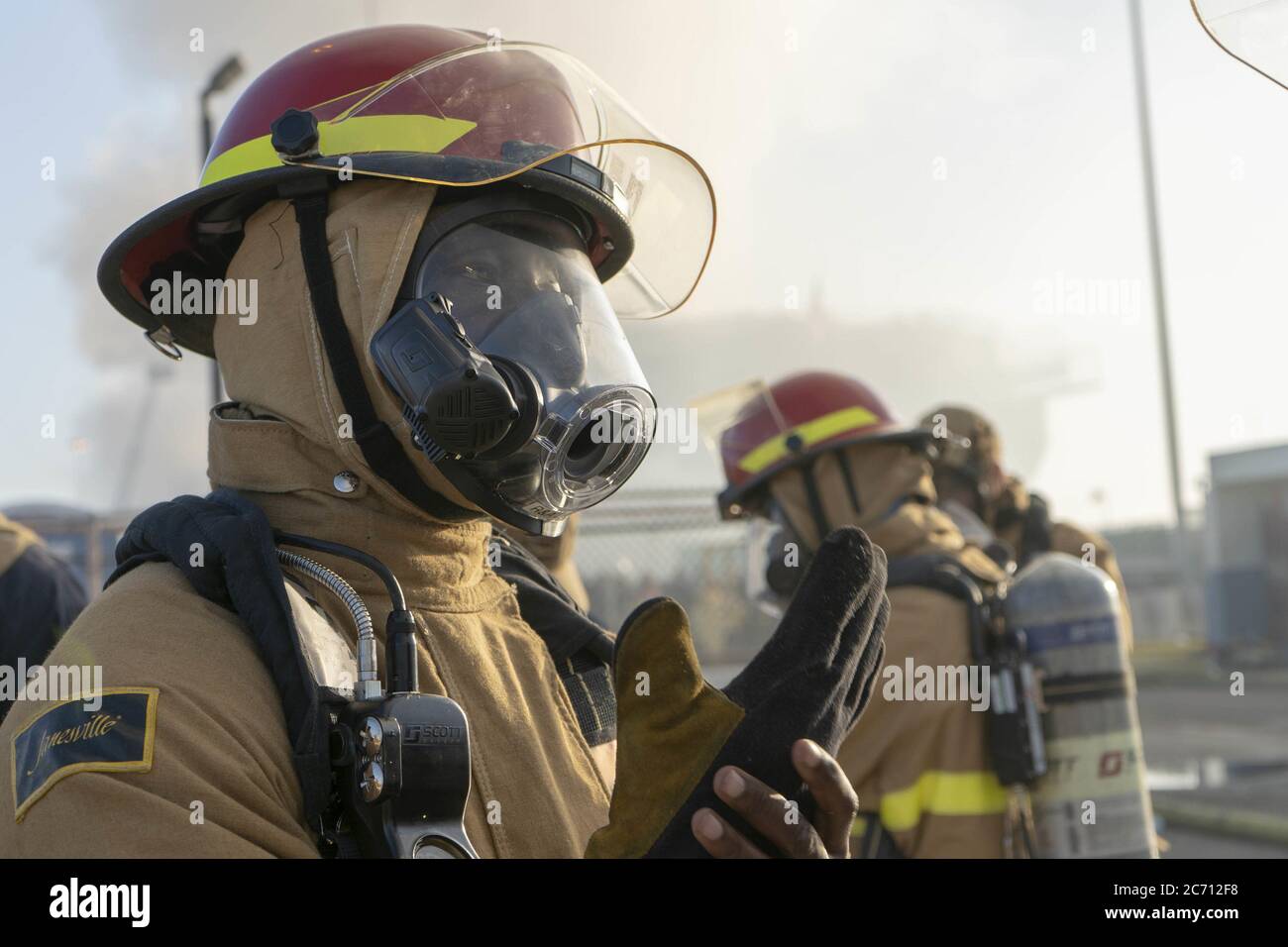San Diego, United States. 13th July, 2020. U.S. Navy Sailors prepare to combat a fire aboard the USS Bonhomme Richard (LHD 6) on July 12, 2020. On the morning of July 12, a fire was called away aboard the ship while it was moored pier side at Naval Base San Diego. Base and shipboard firefighters responded to the fire. USS Bonhomme Richard is going through a maintenance availability, which began in 2018. Photo by MC3 Christina Ross/U.S. Navy/UPI Credit: UPI/Alamy Live News Stock Photo