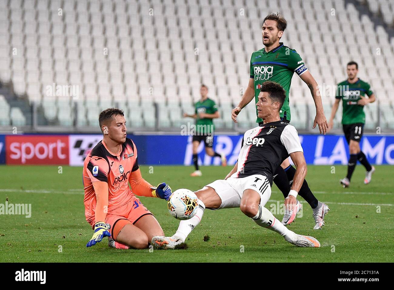 Turin, Italy - 11 July, 2020: Pierluigi Gollini (L) of Atalanta BC makes a save on Cristiano Ronaldo of Juventus FC during the Serie A football match between Juventus FC and Atalanta BC. The match ended in a 2-2 tie. Credit: Nicolò Campo/Alamy Live News Stock Photo