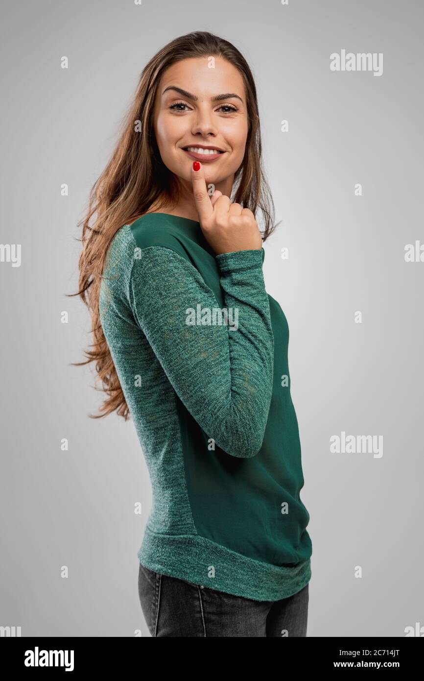 Happy young hispanic woman thinking hi-res stock photography and images ...