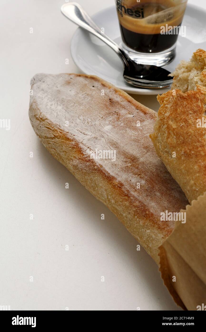Slices of fresh baked bread with a cup of espresso Stock Photo