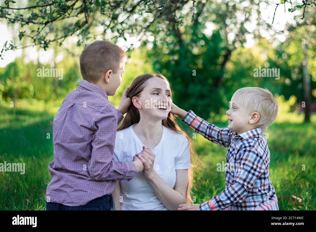 Mother stroking sons head hi-res stock photography and images - Alamy