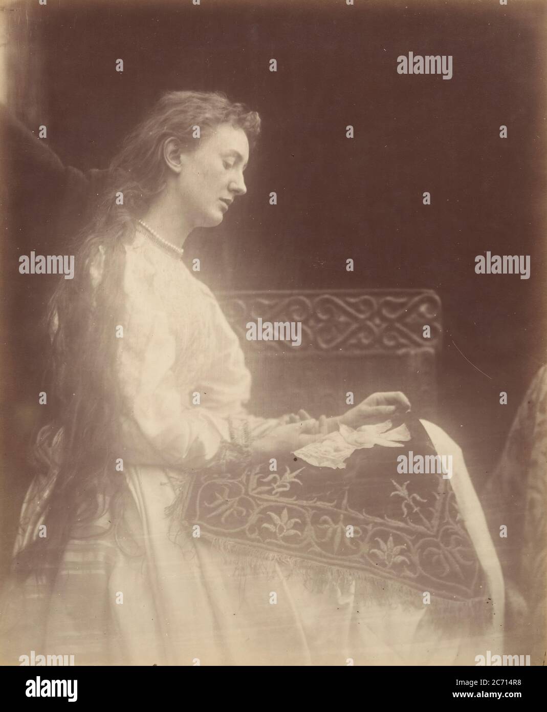Elaine, 1874. A photographic illustration to Alfred Tennyson's &quot;Idylls of the King&quot;; a series of narrative poems based on the legends of King Arthur. Stock Photo