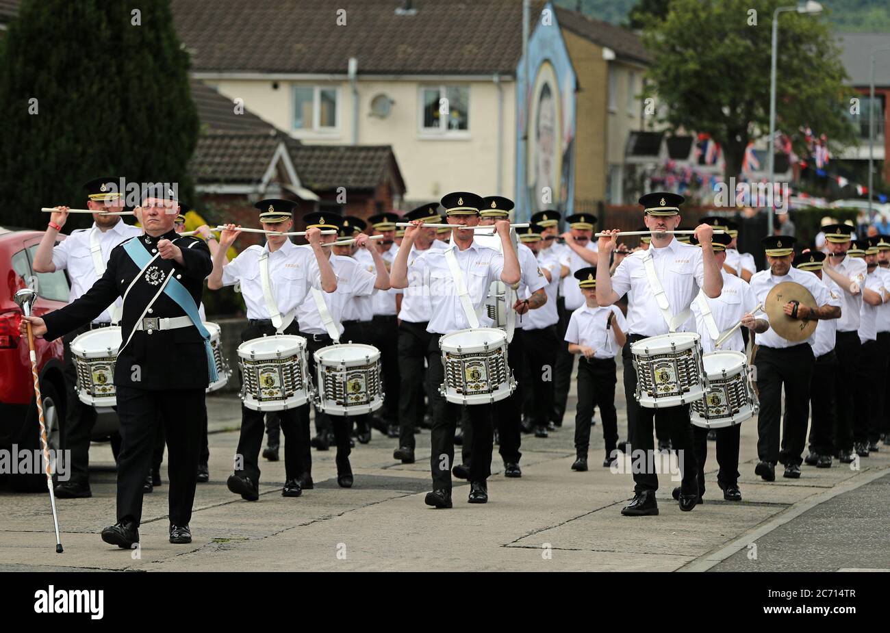 Members of the Shankill Road Defenders flute band march though the lower Shankill estate, Belfast, for social distanced Twelfth of July celebrations despite advice to remain at home due to the coronavirus outbreak. The Twelfth is being celebrated on 13 July as 12 July this year falls on a Sunday. Stock Photo