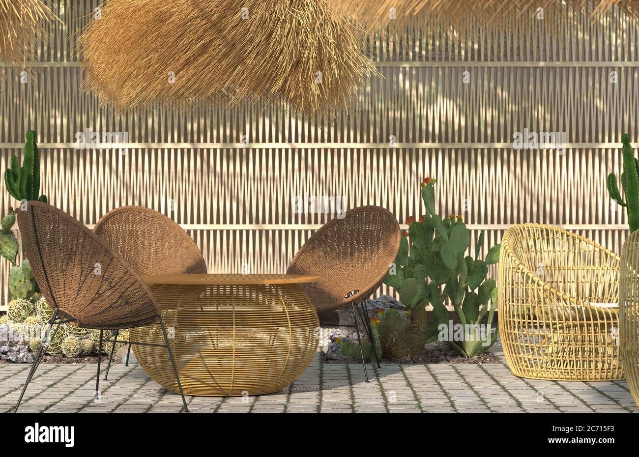 The interior of the open summer terrace of a restaurant or cafe with rattan wicker furniture and thatched lampshades on the background of a decorative Stock Photo