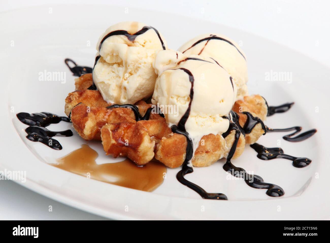 Waffle with icecream chocolate and maple syrup Stock Photo