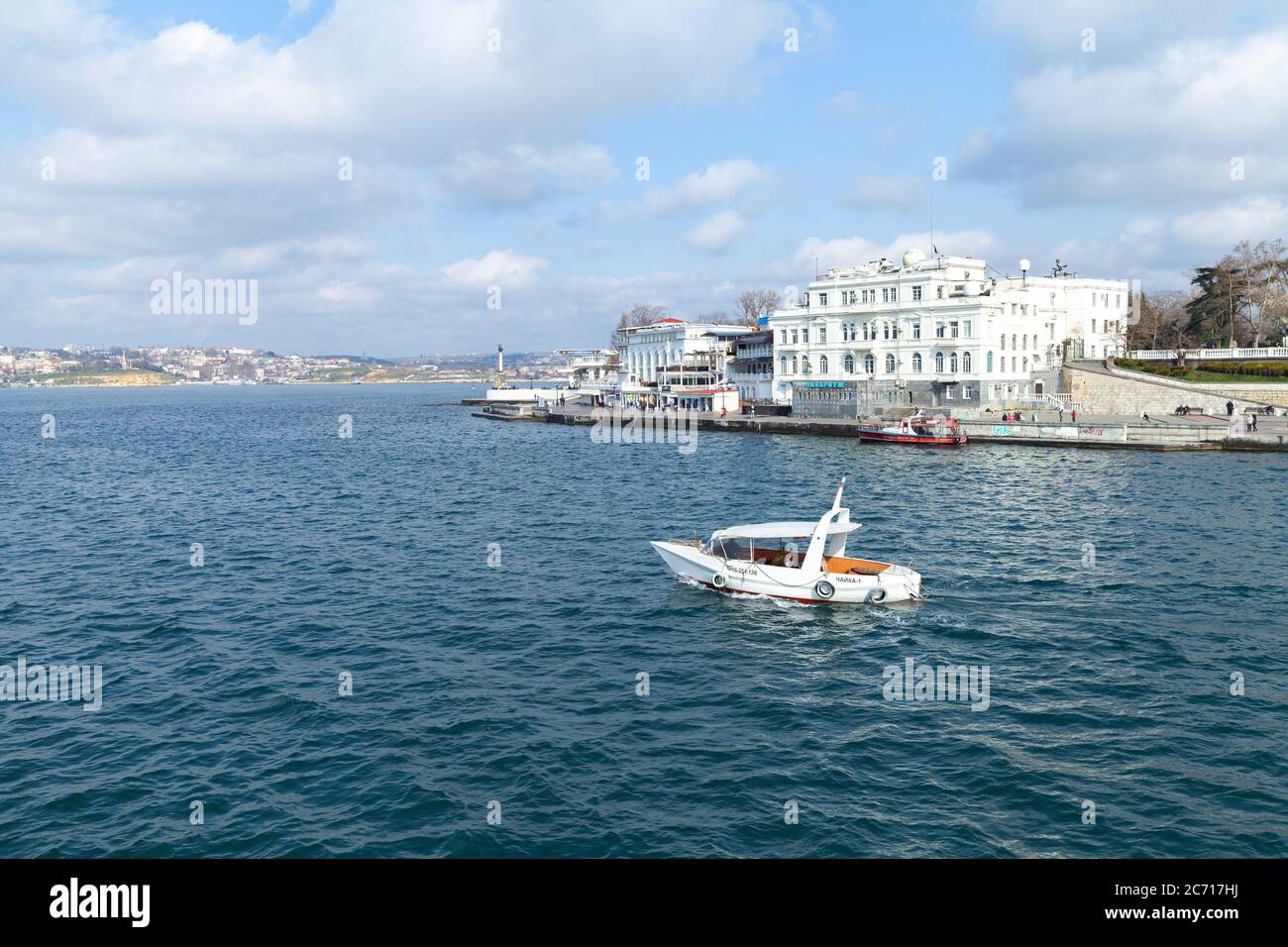 Sevastopol, Crimea - March 25, 2017: Pleasure boat with tourists goes on the Artillery bay of Sevastopol Stock Photo