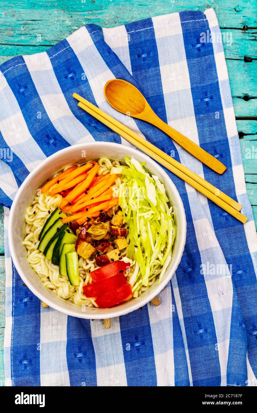 Traditional Korean noodle bowl with smoked chicken, fresh sliced